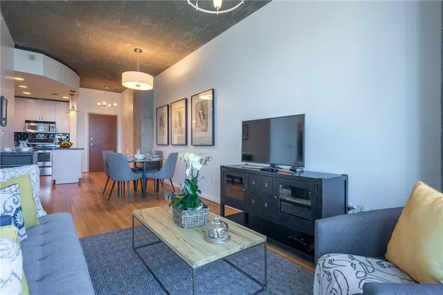 a living room with furniture and a flat screen tv