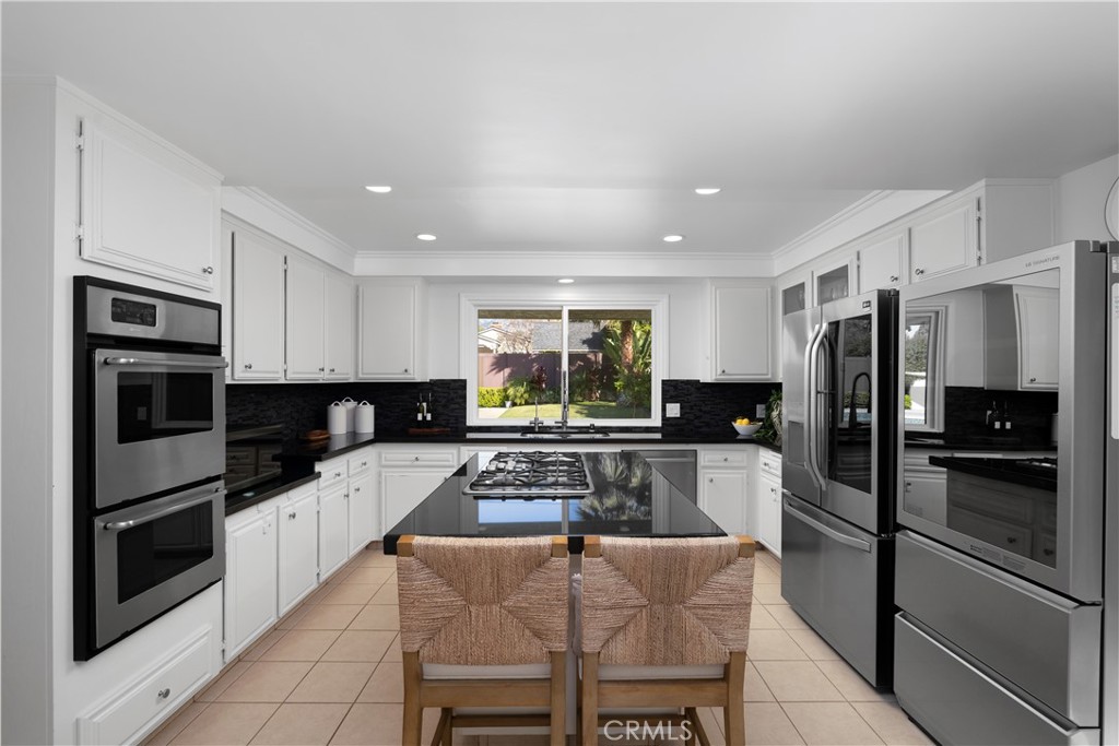 3611 Grayburn Road Pasadena, CA 91107 - Photo 13 of 41 a kitchen with granite countertop a refrigerator stove microwave and sink