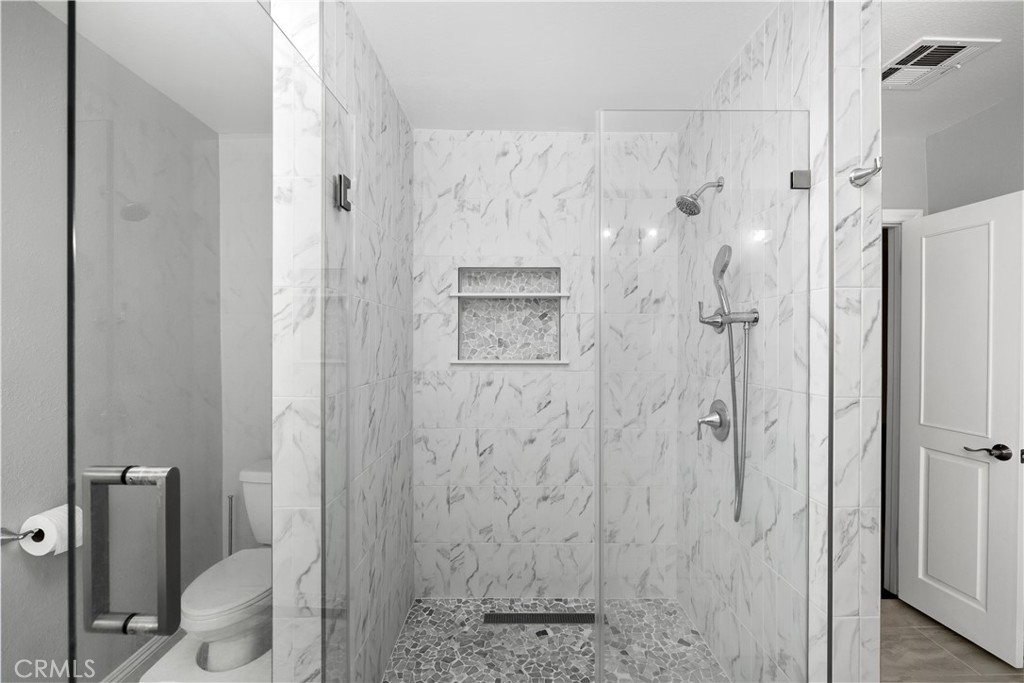 3611 Grayburn Road Pasadena, CA 91107 - Photo 22 of 41 a bathroom with a shower and toilet