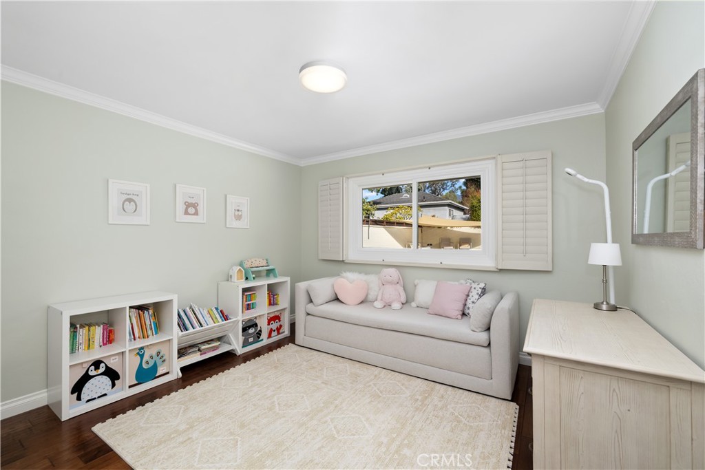 3611 Grayburn Road Pasadena, CA 91107 - Photo 23 of 41 a living room with furniture and a book shelf