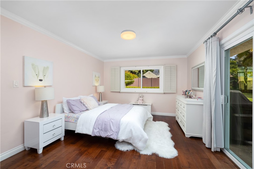 3611 Grayburn Road Pasadena, CA 91107 - Photo 25 of 41 a bedroom with a bed and wooden floor