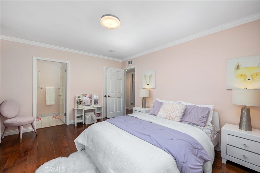 3611 Grayburn Road Pasadena, CA 91107 - Photo 26 of 41 a bedroom with a bed and wooden floor
