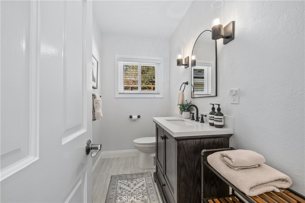3611 Grayburn Road Pasadena, CA 91107 - Photo 28 of 41 a bathroom with a sink toilet and mirror