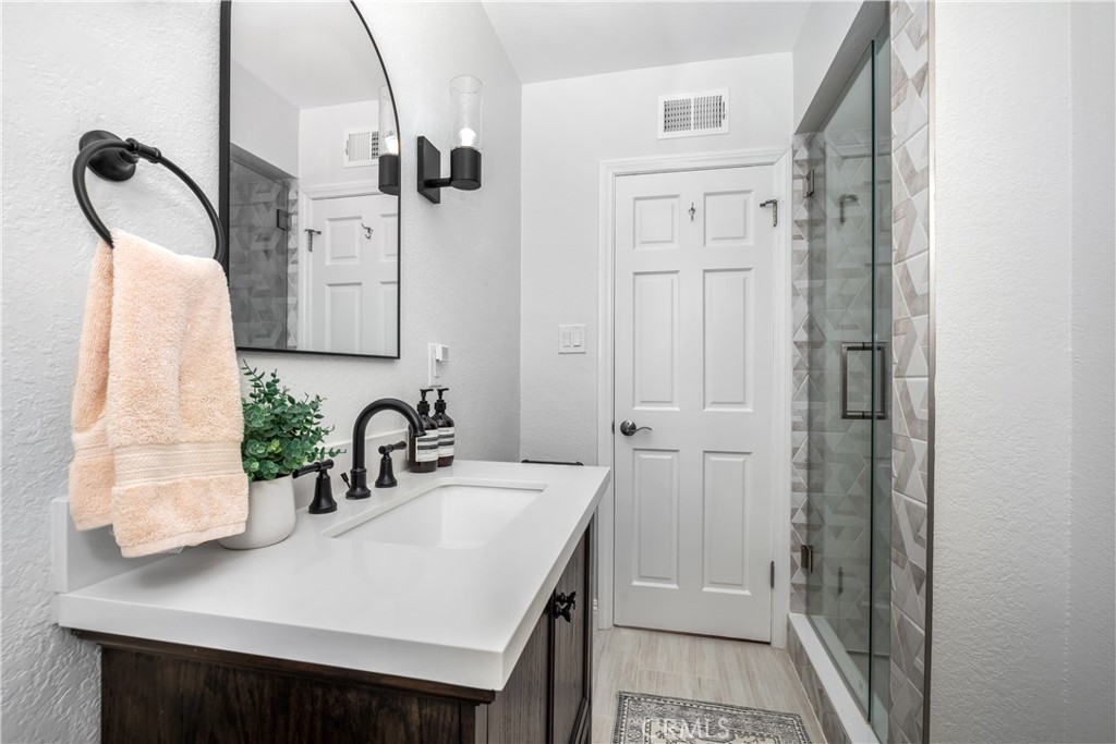 3611 Grayburn Road Pasadena, CA 91107 - Photo 29 of 41 a bathroom with a sink and mirror
