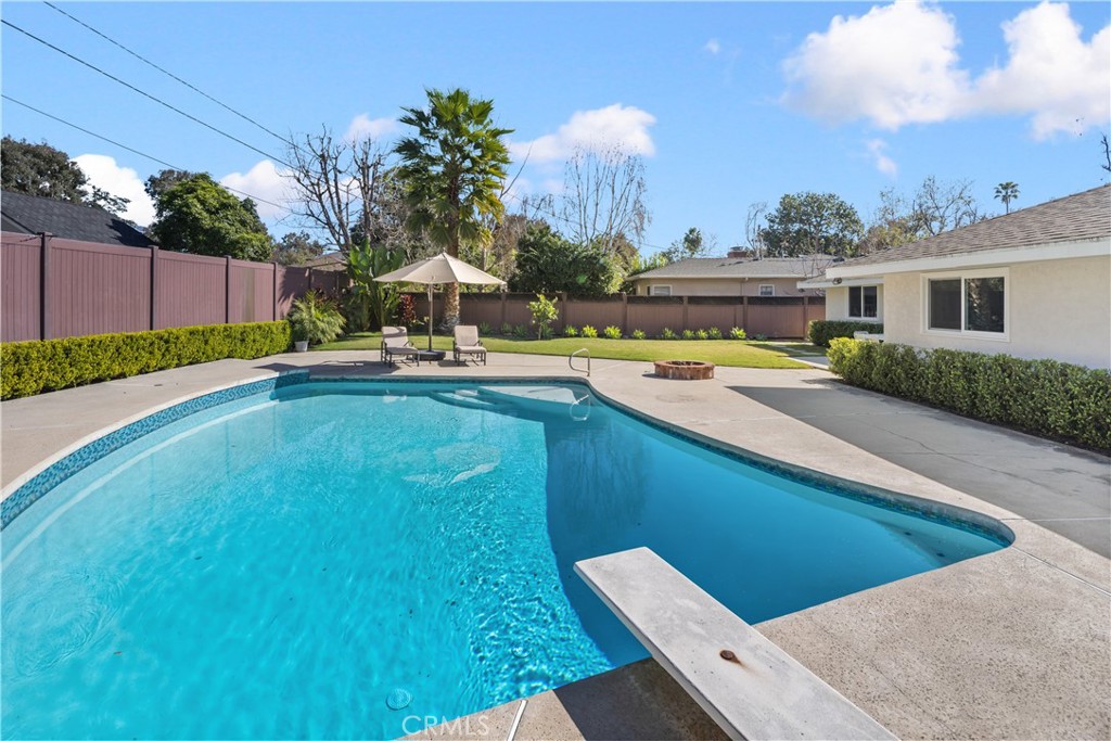 3611 Grayburn Road Pasadena, CA 91107 - Photo 34 of 41 a view of a swimming pool with a lounge chairs