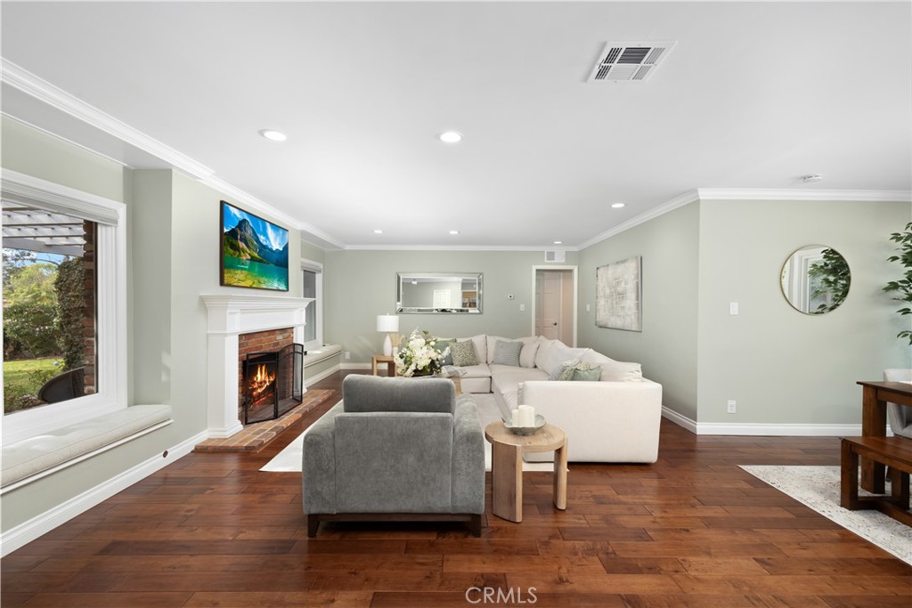 3611 Grayburn Road Pasadena, CA 91107 - Photo 5 of 41 a living room with fireplace furniture and a flat screen tv