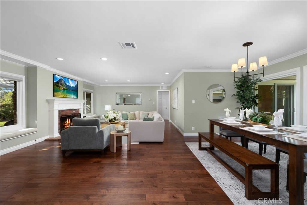 3611 Grayburn Road Pasadena, CA 91107 - Photo 9 of 41 a living room with fireplace furniture and a chandelier