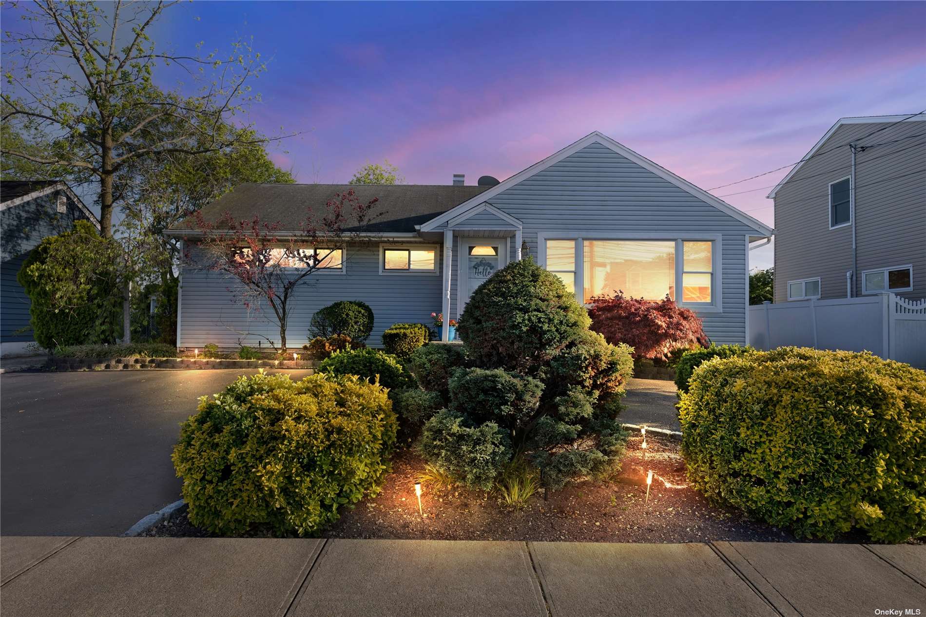 1716 Camp Avenue Merrick, NY 11566 - Photo 1 of 1 a front view of a house with garden