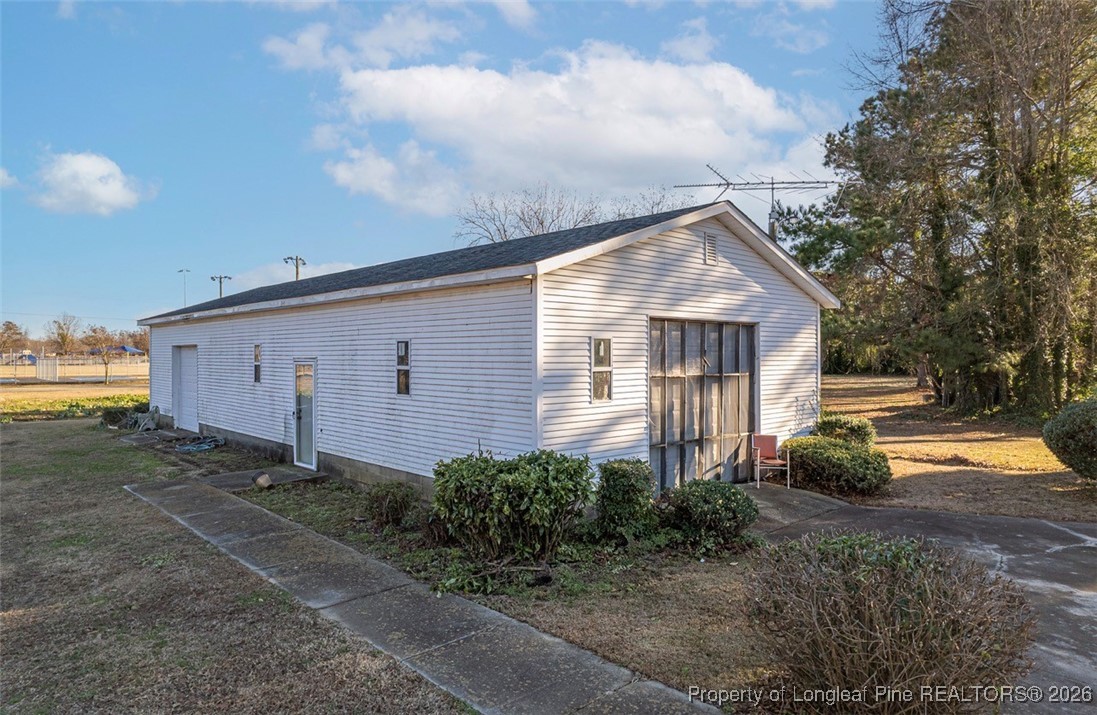 405 South Bond Street Rowland, NC 28383 - Photo 17 of 19 a front view of a house with garden