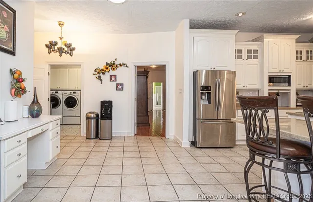 a view of a livingroom with furniture and windows