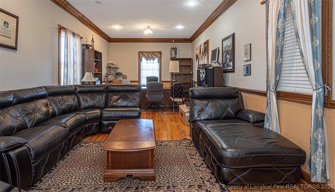 405 South Bond Street Rowland, NC 28383 - Photo 8 of 19 a living room with furniture and wooden floor