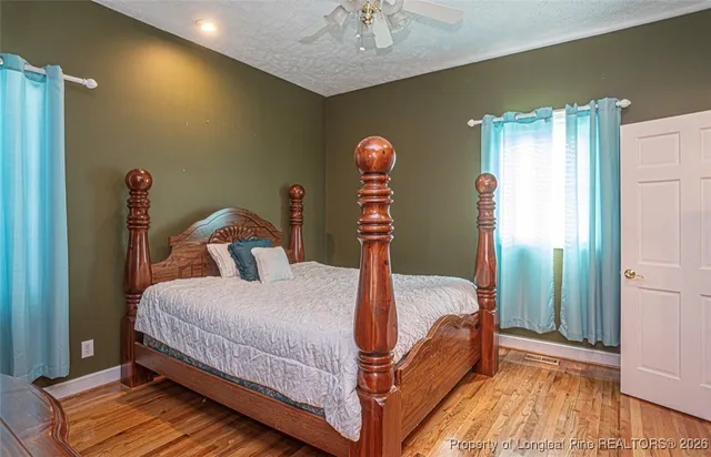 a bathroom with a sink mirror and a bathtub