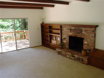 17 Springhill Drive Cazadero, CA 95421 - Photo 3 of 8 a view of an empty room with a fireplace and a window