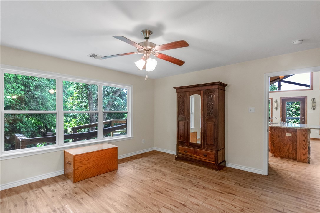 9997 Calhoun Road Bryan, TX 77808 - Photo 22 of 50 a view of workspace with wooden floor and fan