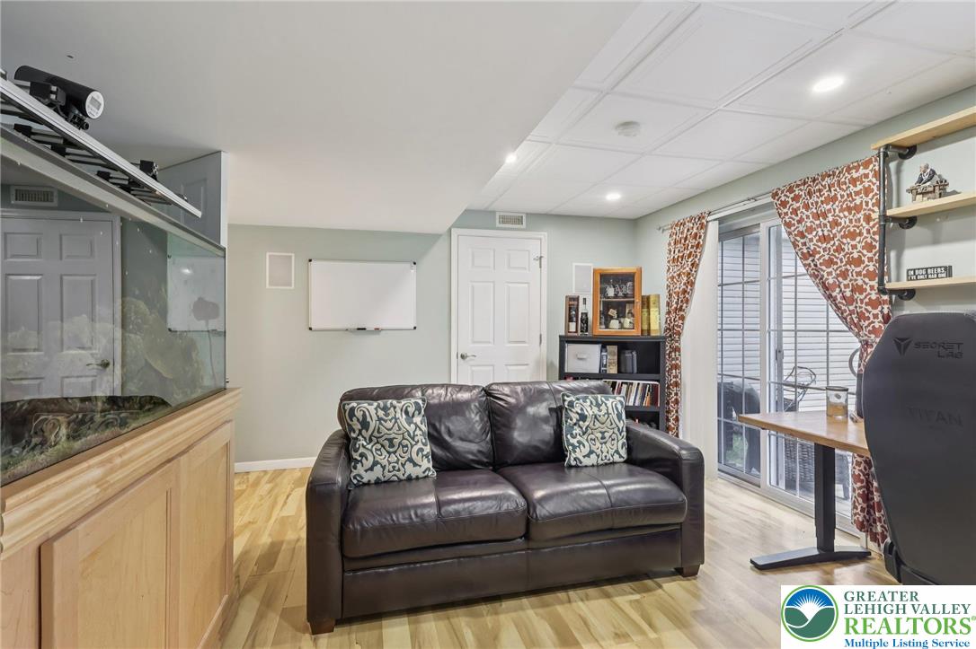 5192 Spring Ridge Drive East Macungie, PA 18062 - Photo 19 of 22 a living room with furniture and a wooden floor