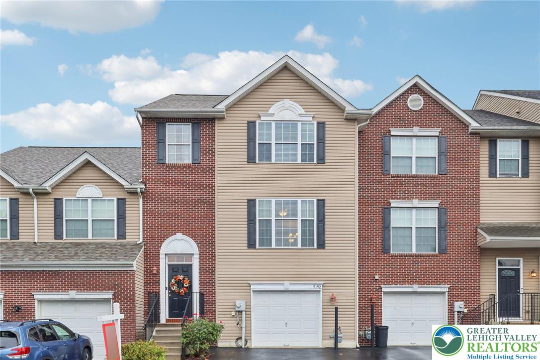 5192 Spring Ridge Drive East Macungie, PA 18062 - Photo 2 of 22 a front view of a house with balcony