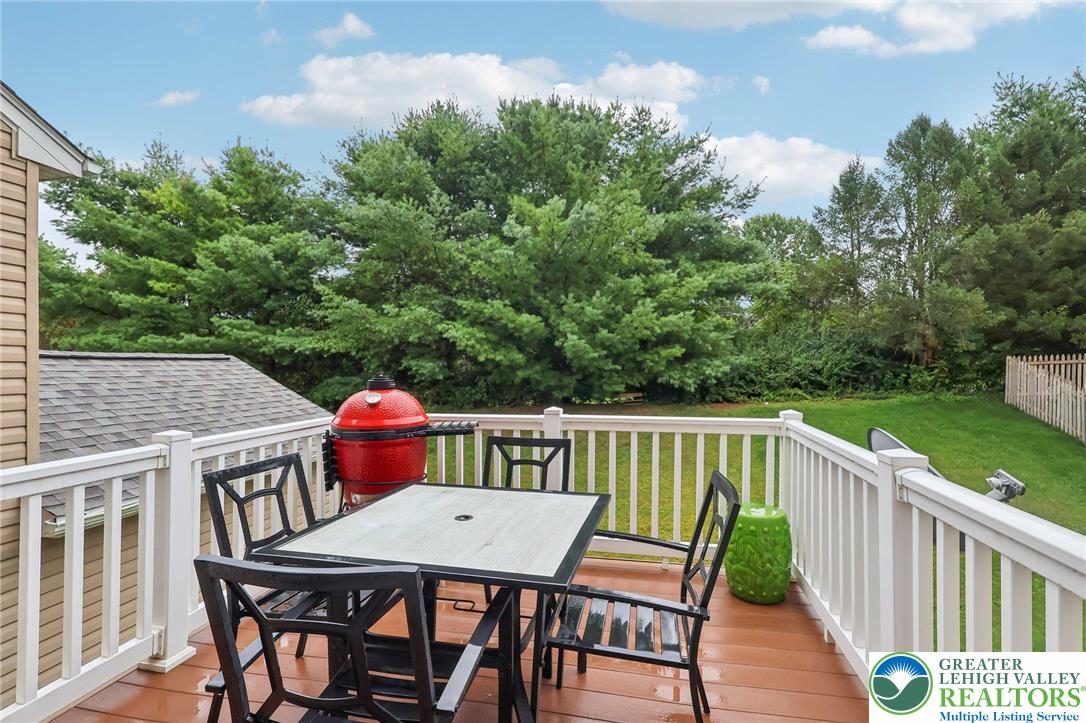 5192 Spring Ridge Drive East Macungie, PA 18062 - Photo 10 of 22 a balcony with wooden floor table and chairs