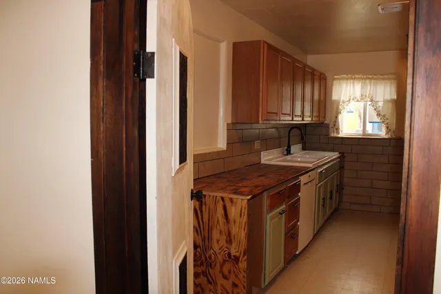 a kitchen with a stove and a cabinets