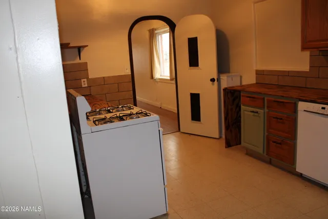 a kitchen with a stove and a microwave