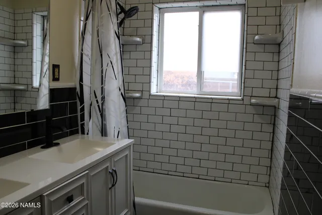 a bathroom with a sink toilet and a mirror