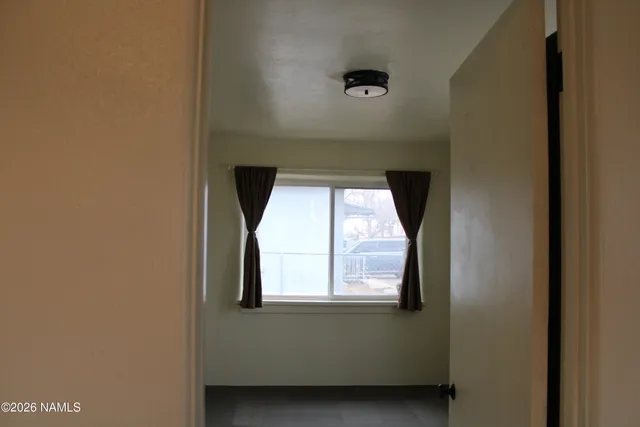 a view of a livingroom with an empty room