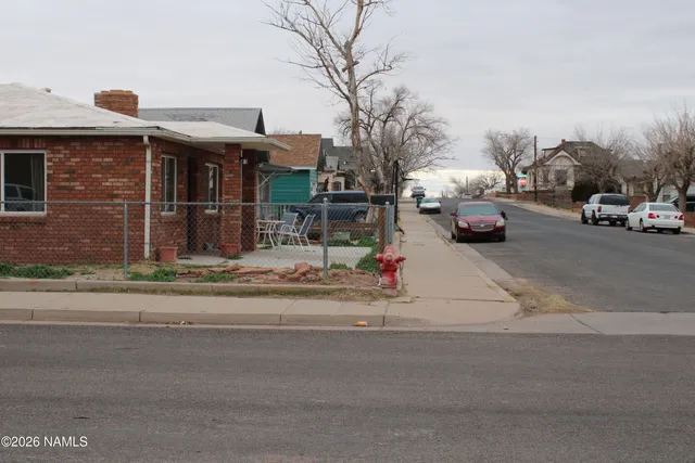 a view of street with parked cars