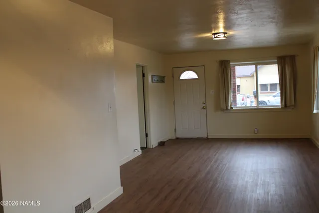 a kitchen with a stove and a refrigerator