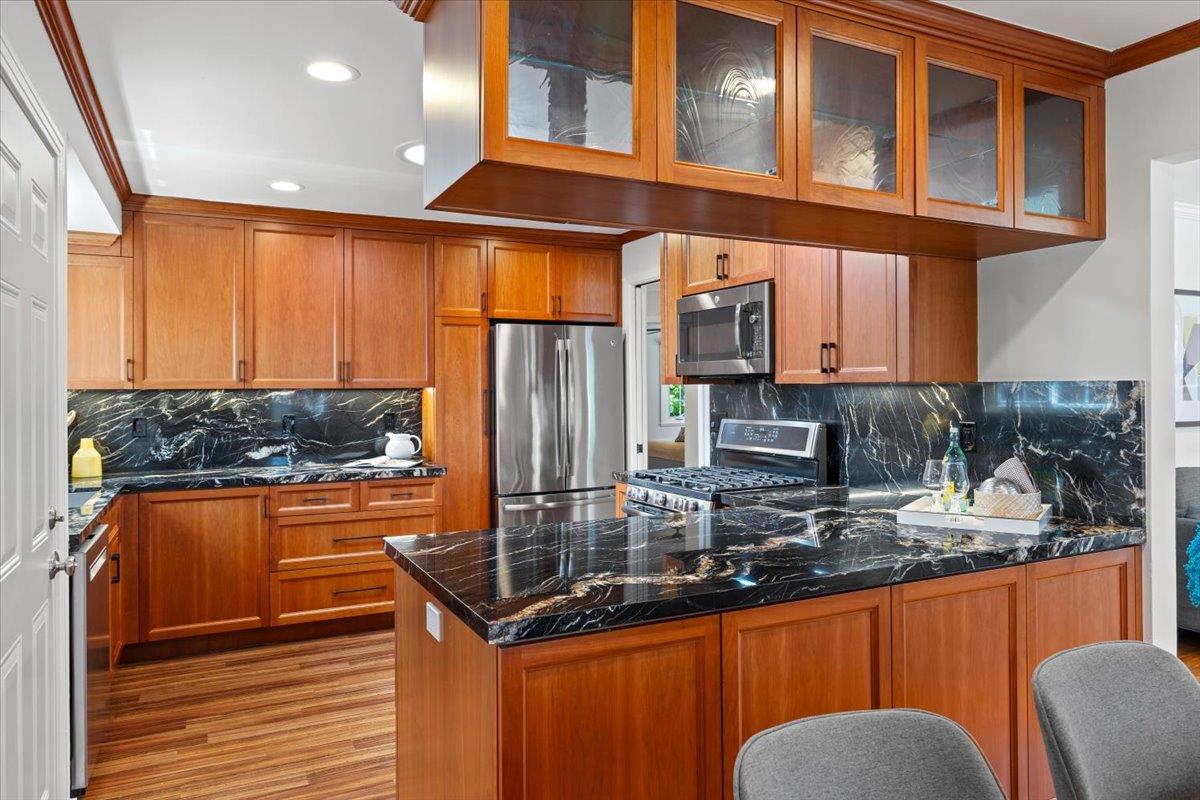 3530 Casanova Drive San Mateo, CA 94403 - Photo 16 of 50 a kitchen with stainless steel appliances granite countertop a sink a stove and a refrigerator