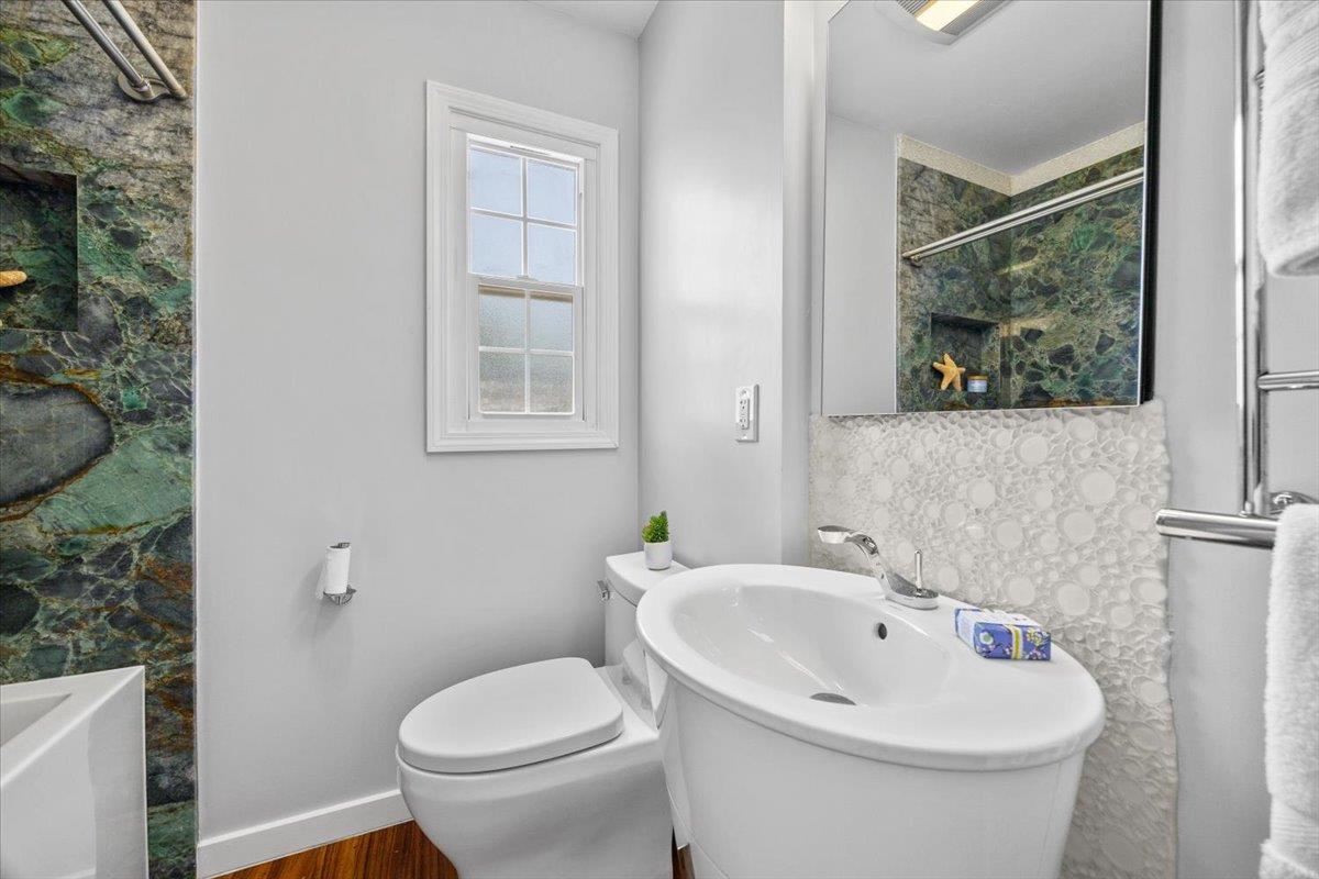 3530 Casanova Drive San Mateo, CA 94403 - Photo 27 of 50 a white toilet sitting next to a bathroom sink