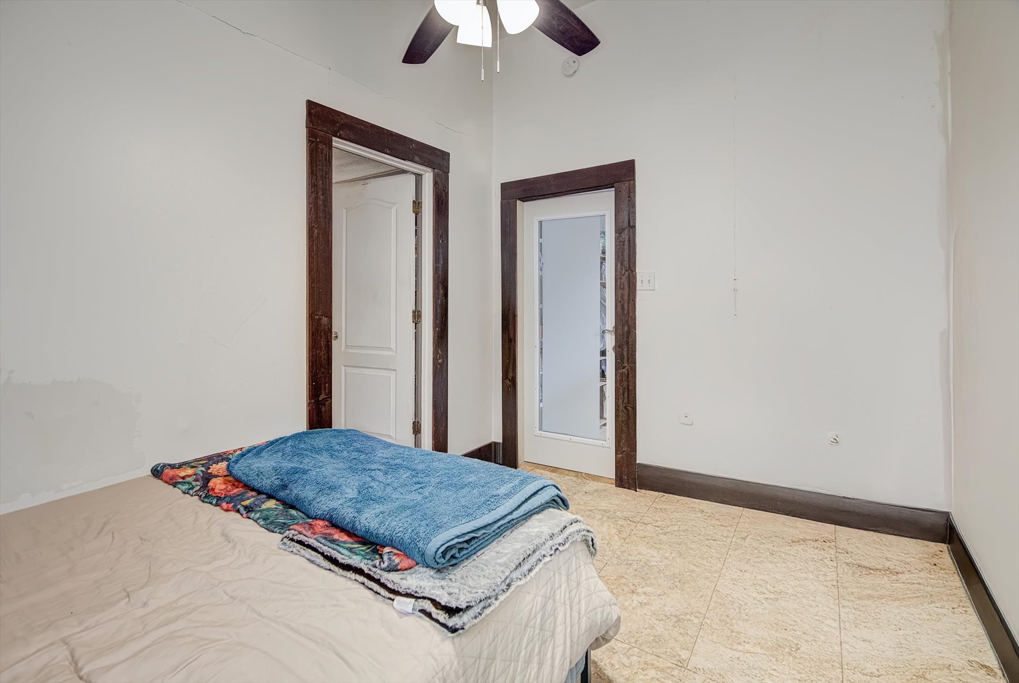 515 Bishop Street Houston, TX 77009 - Photo 11 of 18 a bedroom with a bed and a chandelier fan