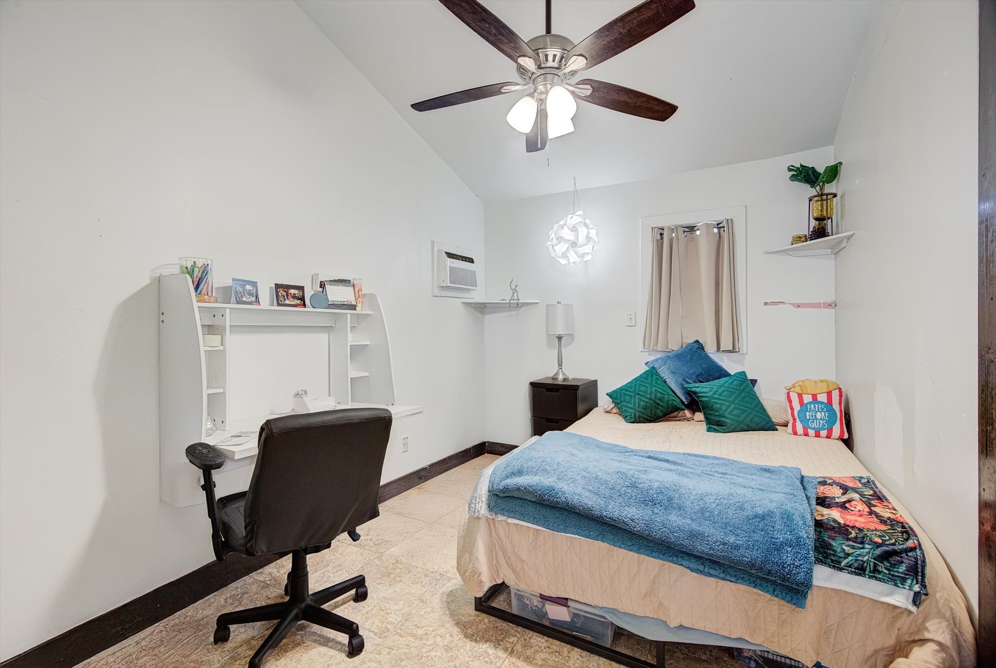 515 Bishop Street Houston, TX 77009 - Photo 10 of 18 a bedroom with a bed and a chandelier