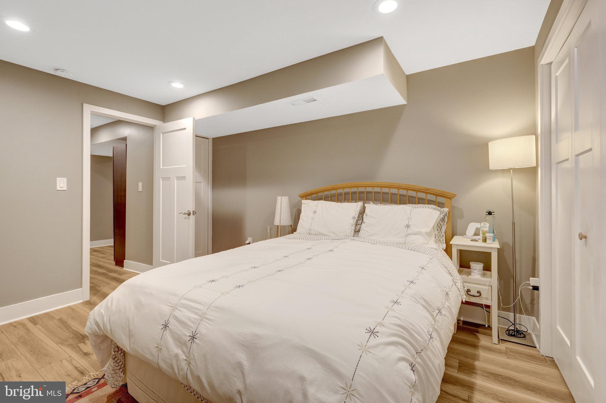 11637 Quail Ridge Court Reston, VA 20194 - Photo 27 of 40 a large bed sitting in a bedroom next to a bathroom