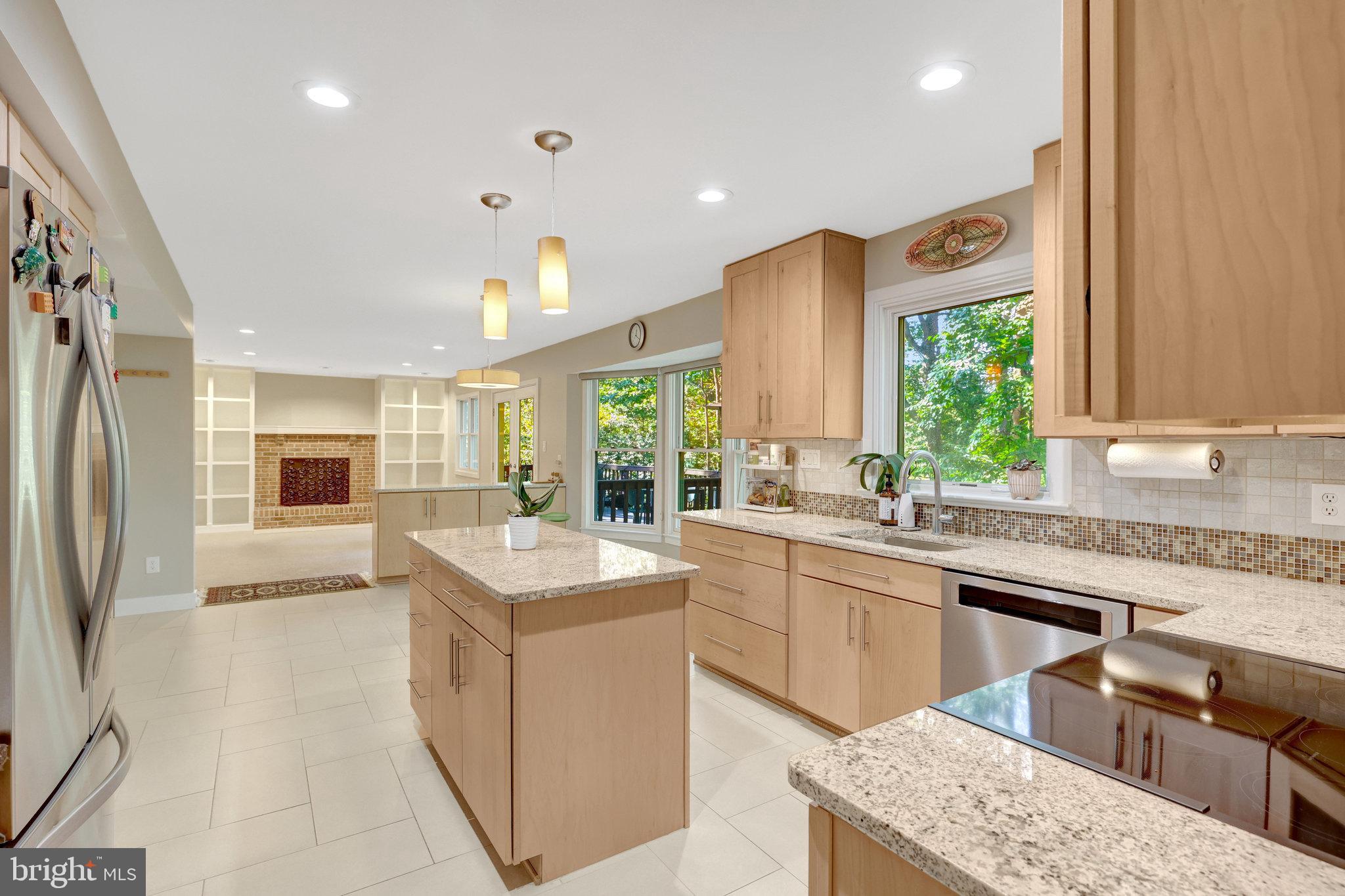 11637 Quail Ridge Court Reston, VA 20194 - Photo 6 of 40 a kitchen with stainless steel appliances granite countertop a sink a stove and a refrigerator