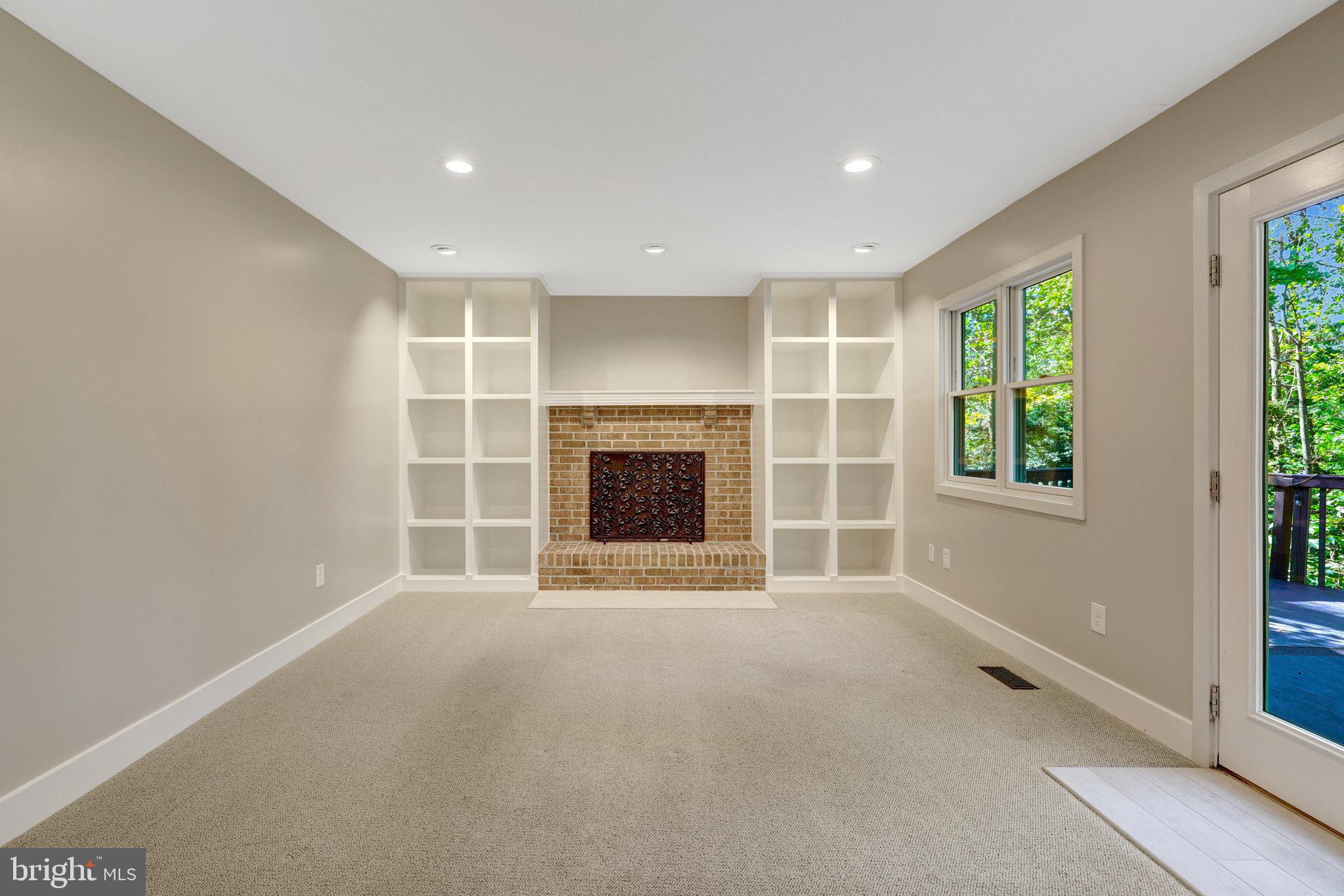 11637 Quail Ridge Court Reston, VA 20194 - Photo 8 of 40 an empty room with windows and fireplace
