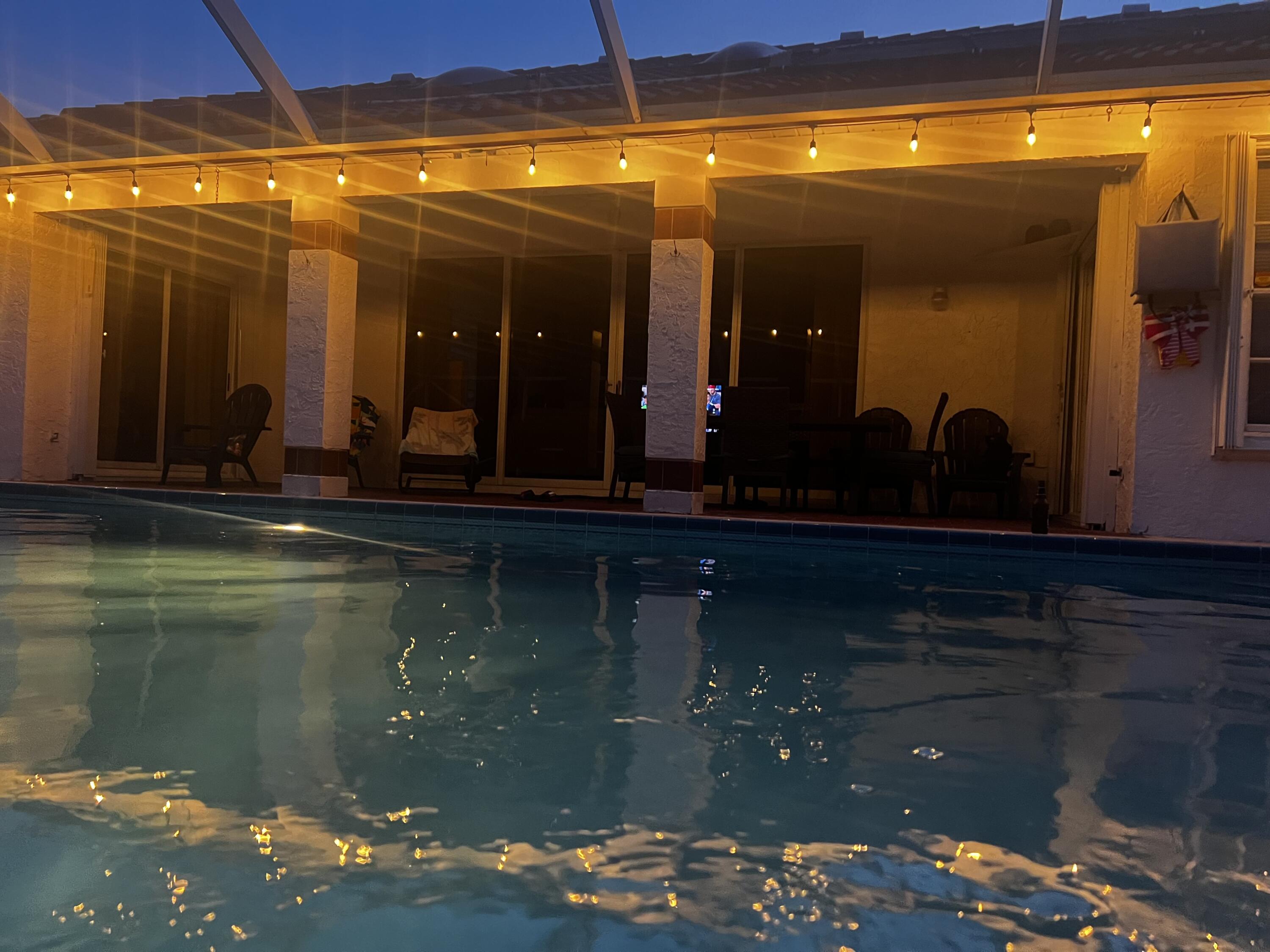 2937 Southeast Cates Circle Port St. Lucie, FL 34952 - Photo 11 of 43 a view of swimming pool with outdoor seating