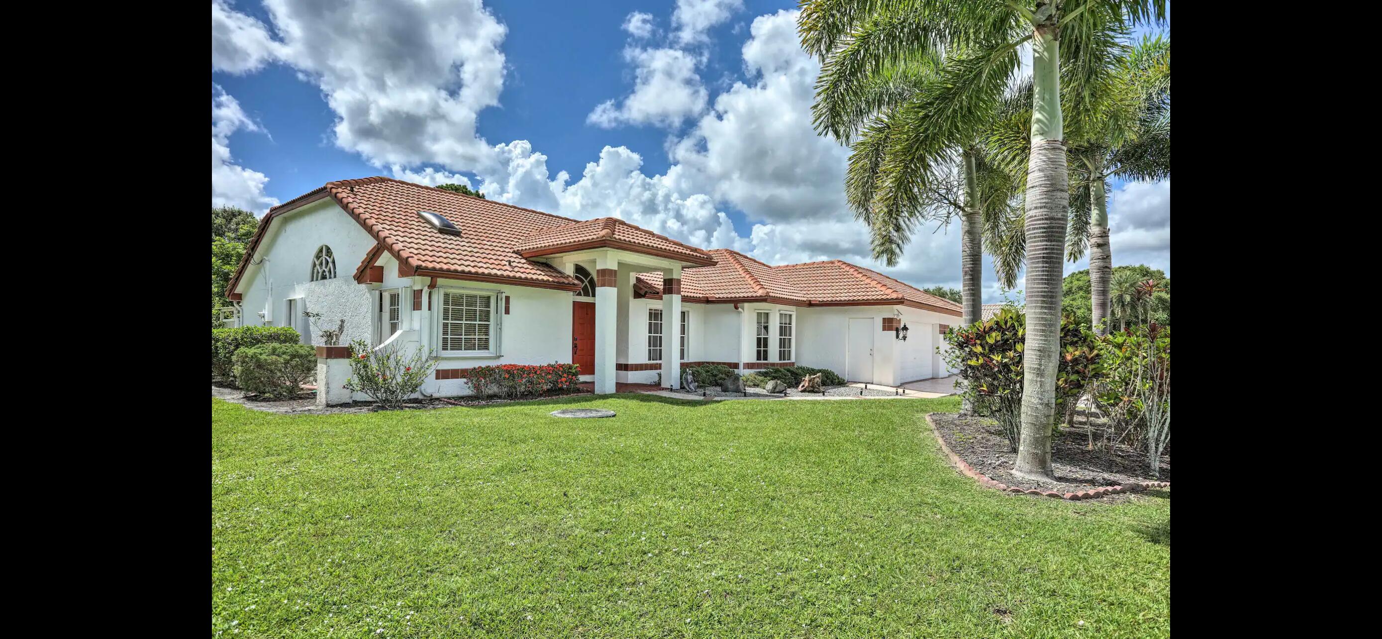 2937 Southeast Cates Circle Port St. Lucie, FL 34952 - Photo 27 of 43 a view of a house with a yard porch and sitting area