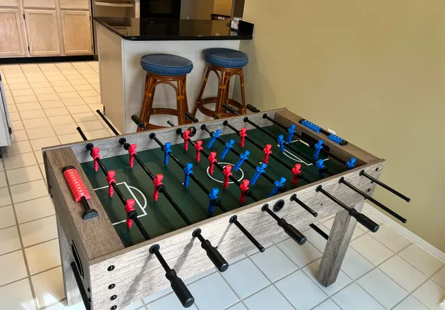 a bedroom with a bed and glass walk in closet