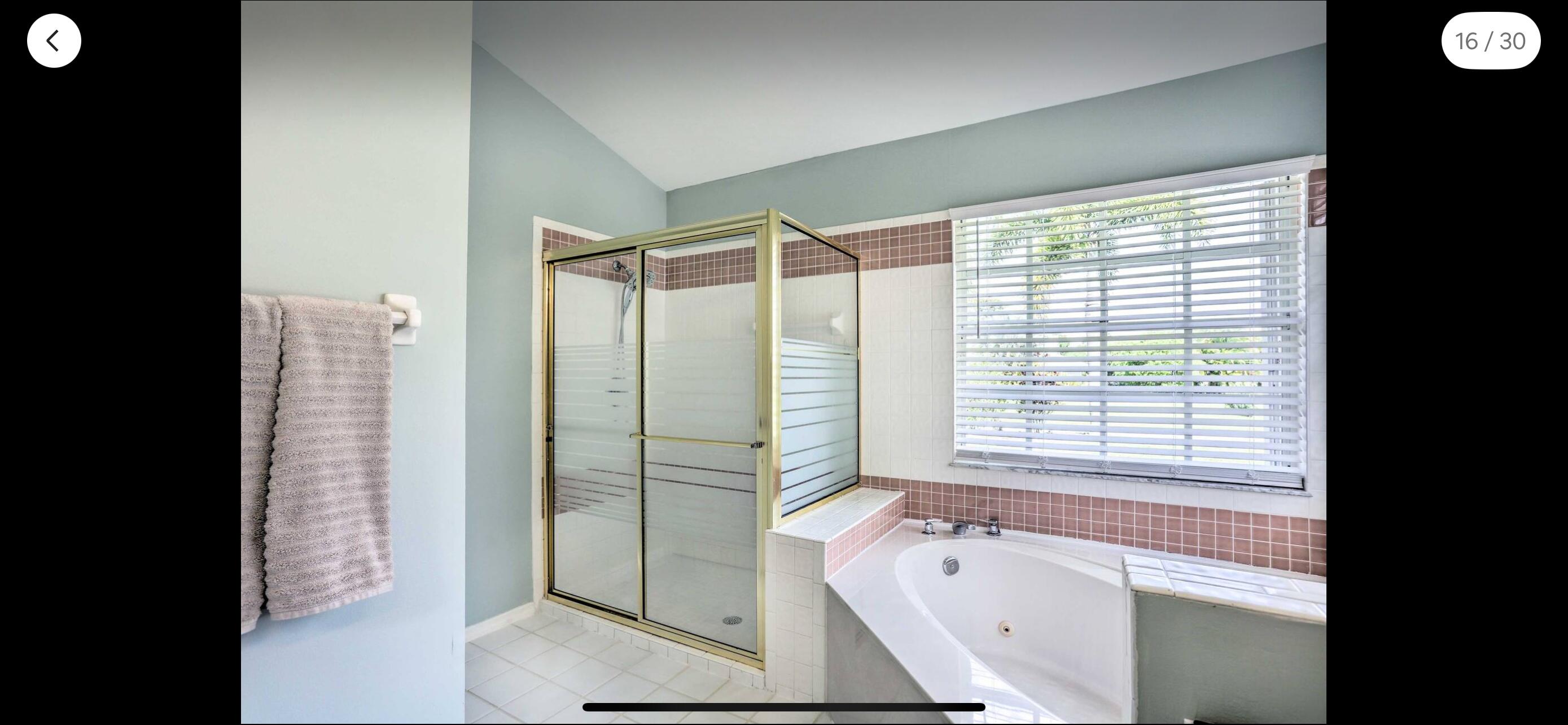 2937 Southeast Cates Circle Port St. Lucie, FL 34952 - Photo 34 of 43 a bathroom with a bathtub and a shower