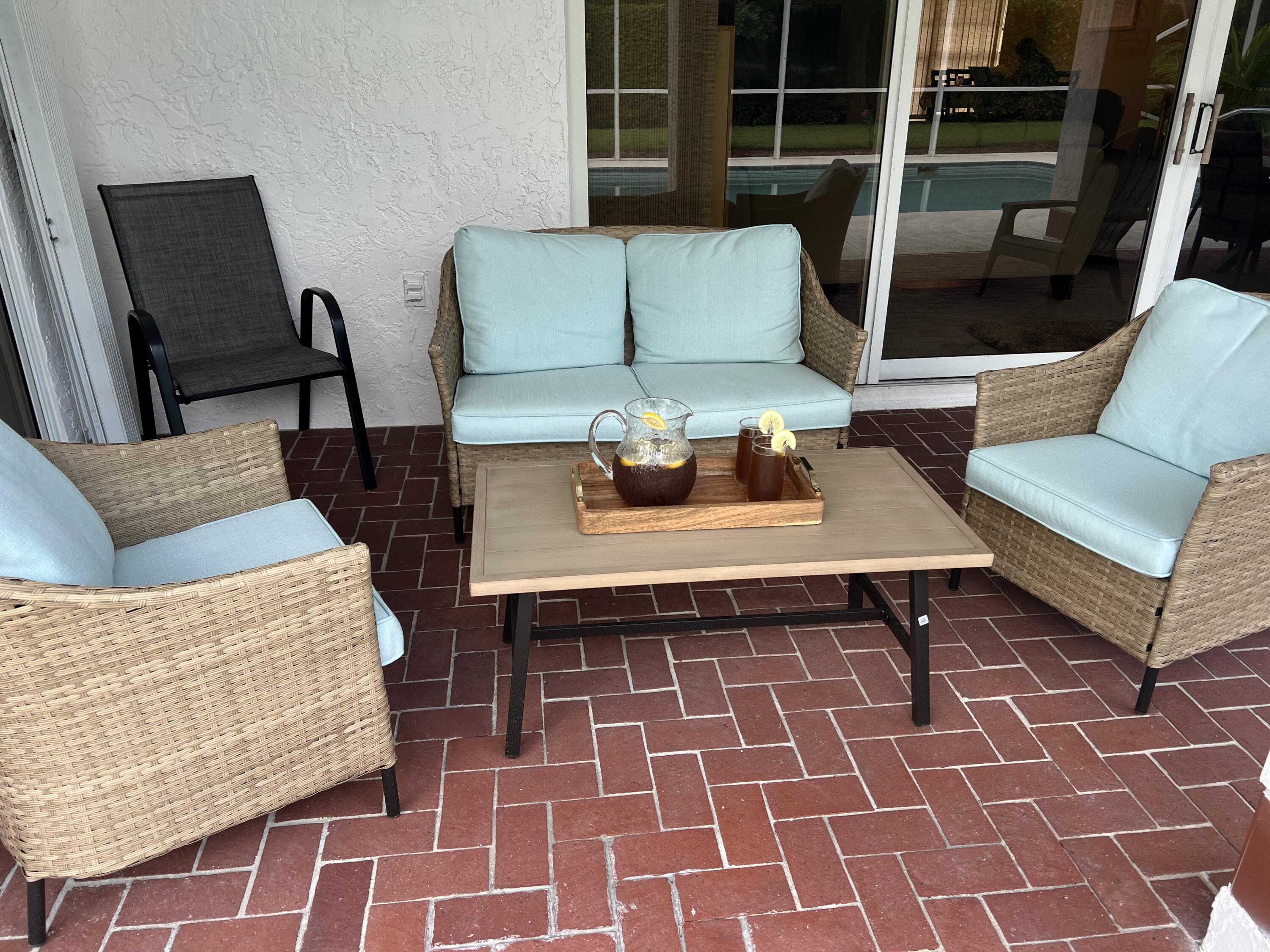 2937 Southeast Cates Circle Port St. Lucie, FL 34952 - Photo 41 of 43 a living room with a couch and a coffee table