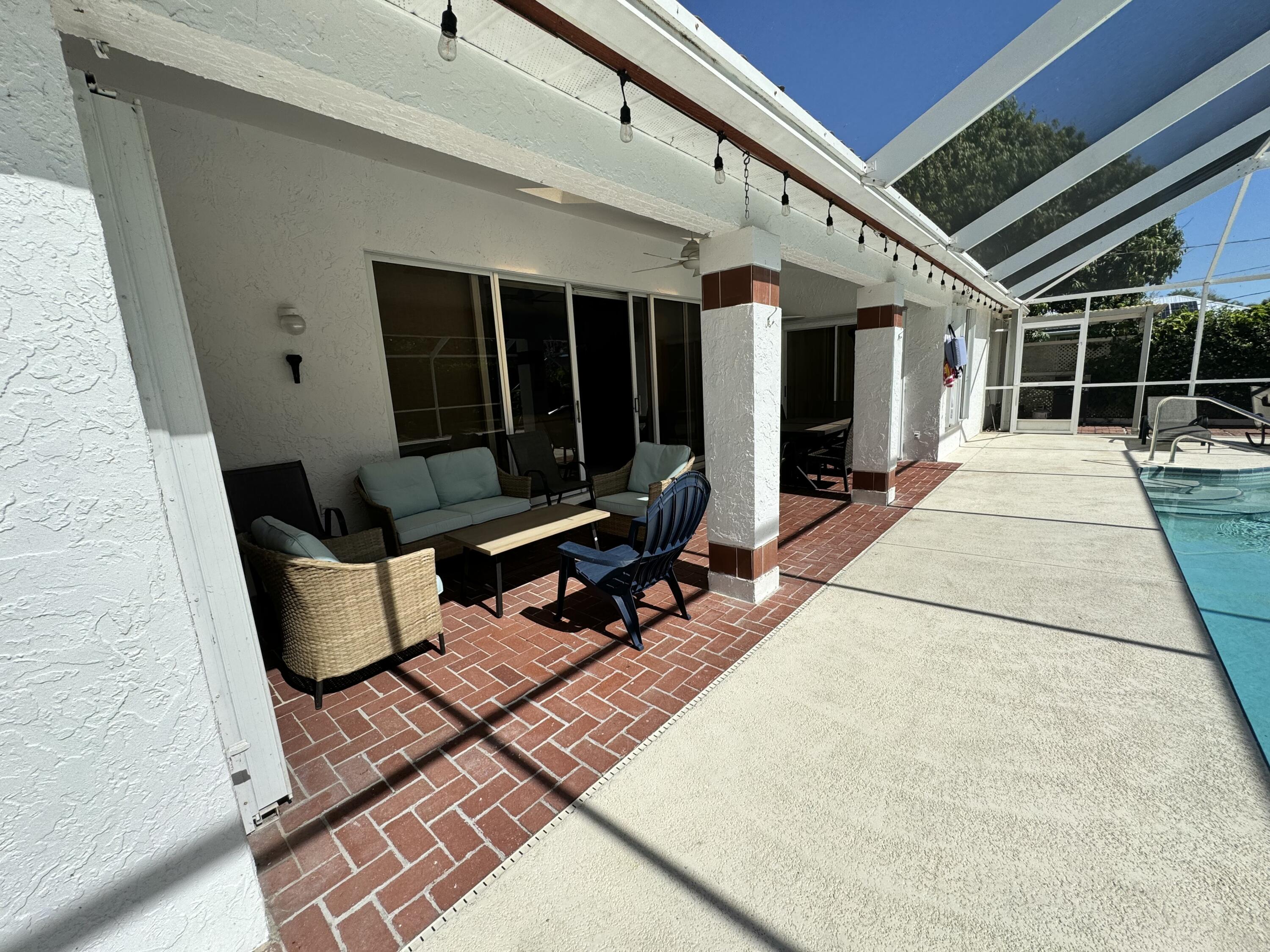 2937 Southeast Cates Circle Port St. Lucie, FL 34952 - Photo 5 of 43 a building outdoor space with seating space