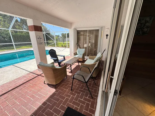 a view of a swimming pool patio