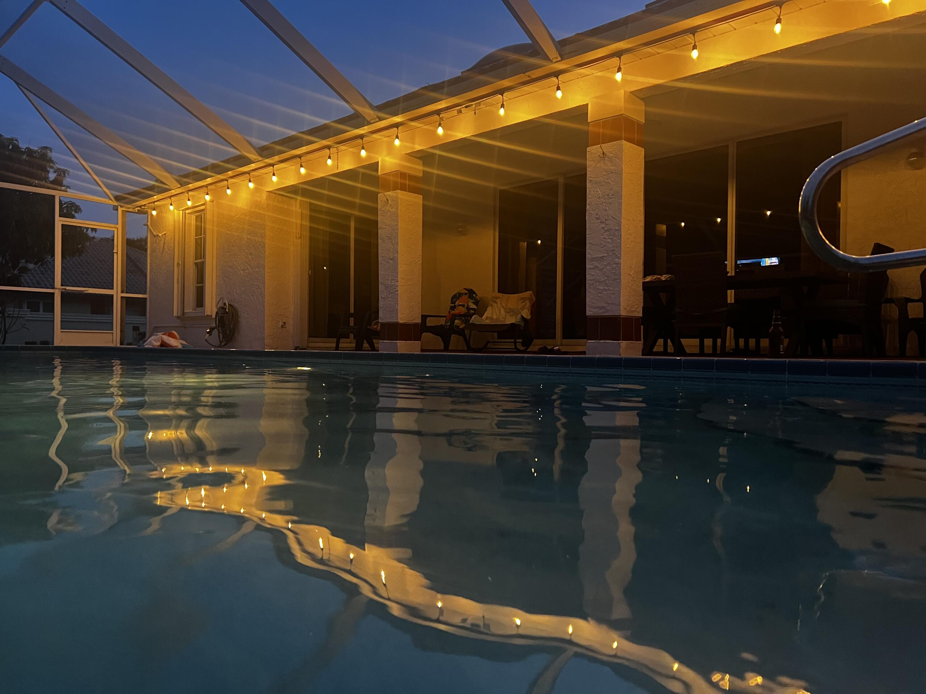 2937 Southeast Cates Circle Port St. Lucie, FL 34952 - Photo 10 of 43 a view of a swimming pool patio