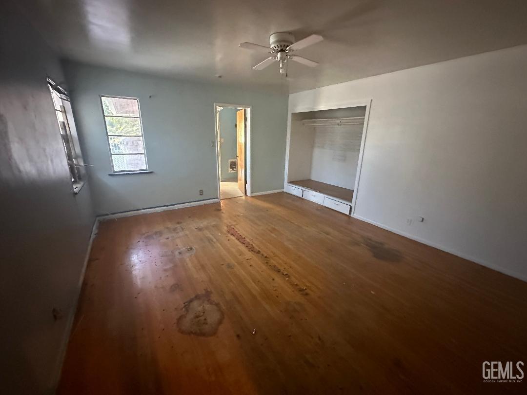 Undisclosed Address Bakersfield, CA 93306 - Photo 11 of 16 an empty room with windows and cabinet