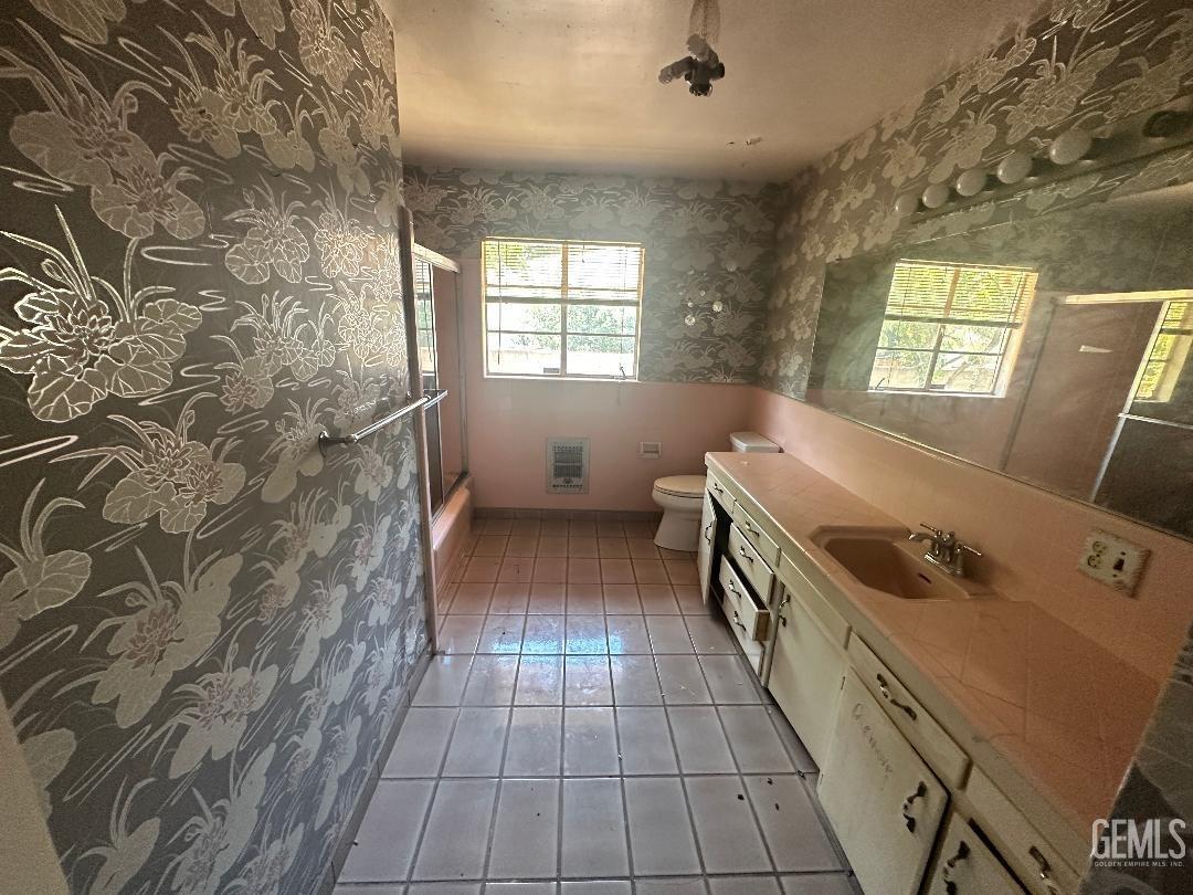 Undisclosed Address Bakersfield, CA 93306 - Photo 12 of 16 a kitchen with a sink a stove top oven and cabinets