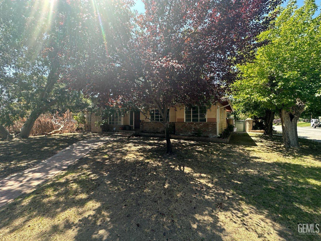 Undisclosed Address Bakersfield, CA 93306 - Photo 3 of 16 a view of a yard with plants and trees