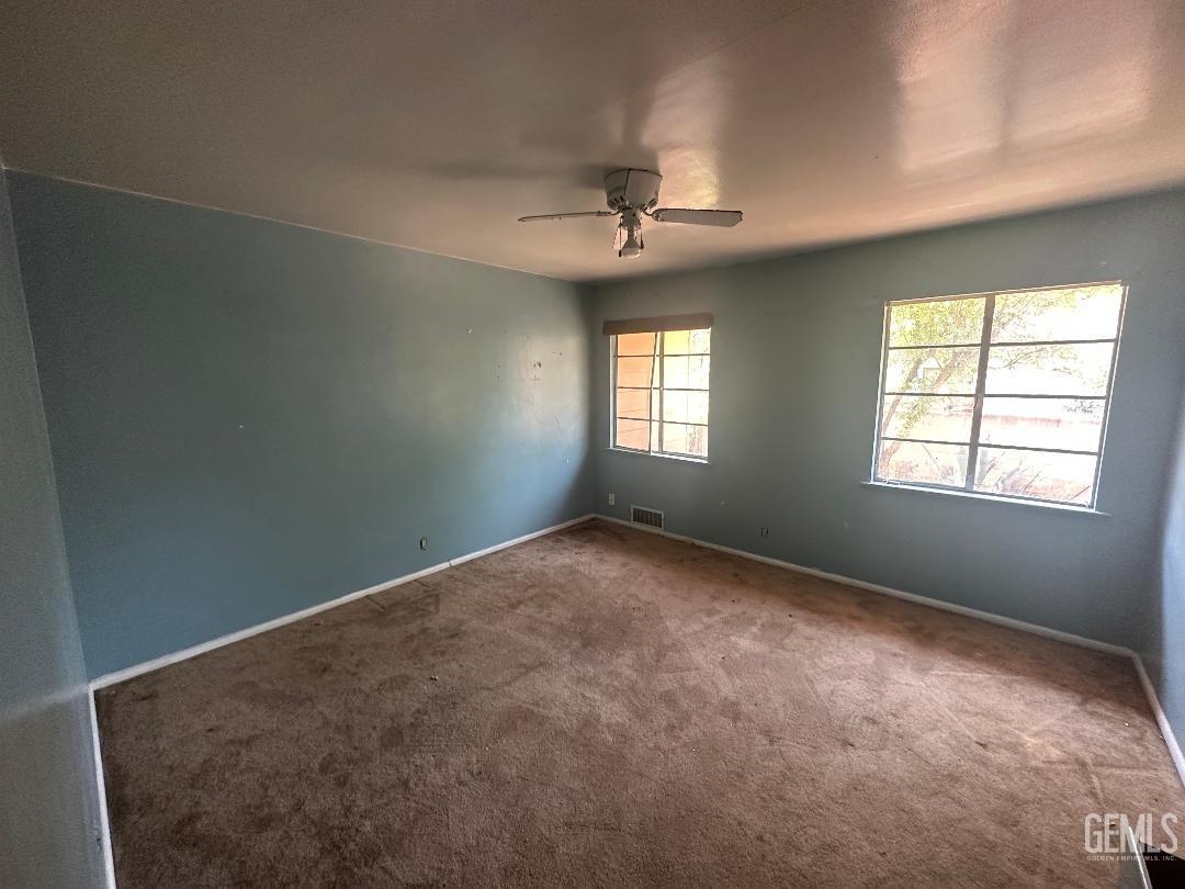 Undisclosed Address Bakersfield, CA 93306 - Photo 6 of 16 a view of an empty room with a window