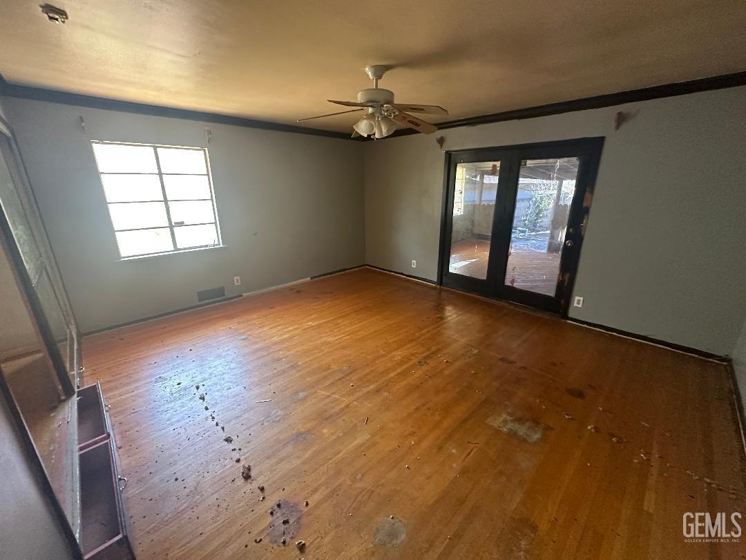 Undisclosed Address Bakersfield, CA 93306 - Photo 7 of 16 wooden floor in an empty room with a window