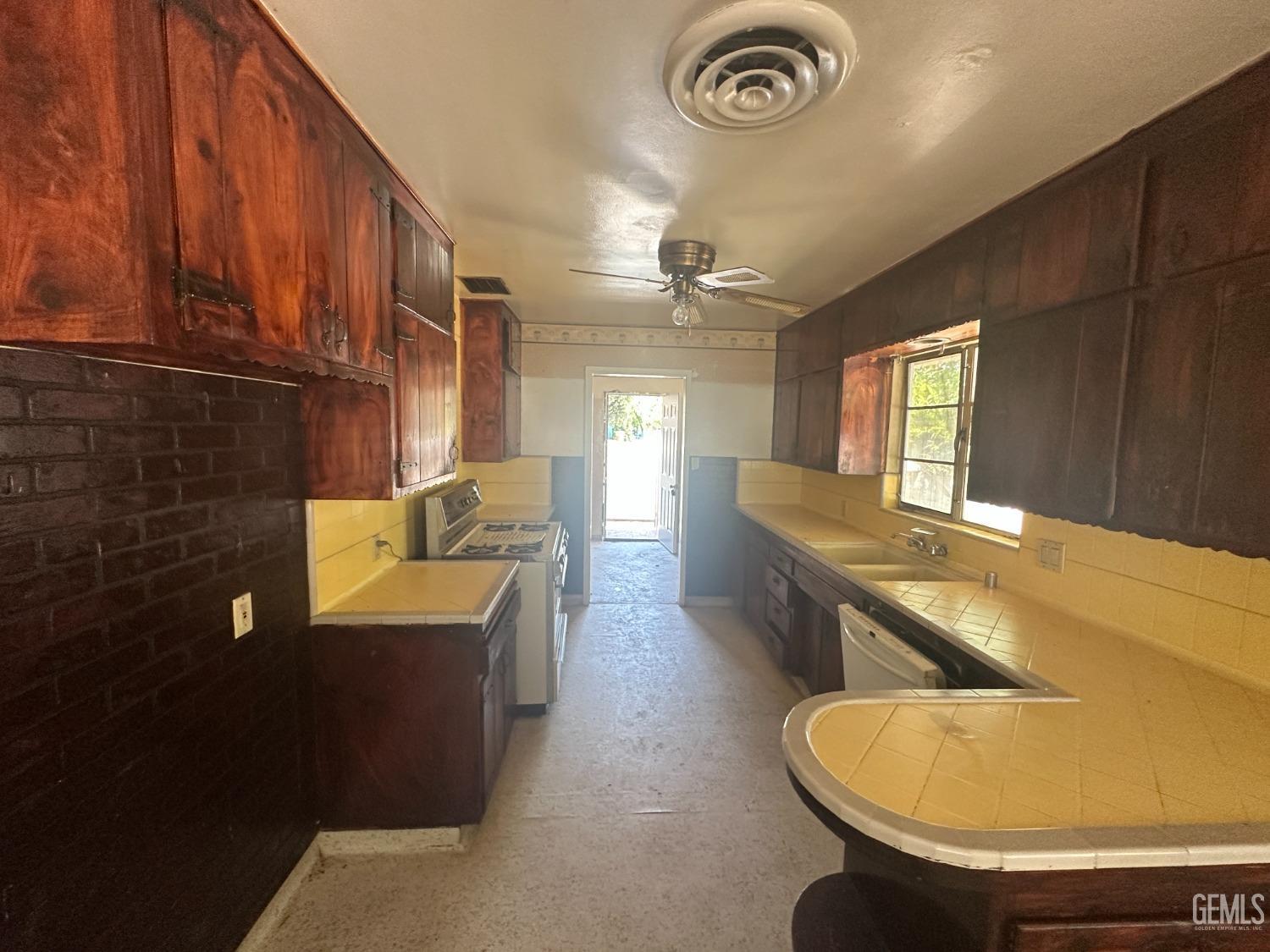 Undisclosed Address Bakersfield, CA 93306 - Photo 8 of 16 a bathroom with a tub sink and mirror