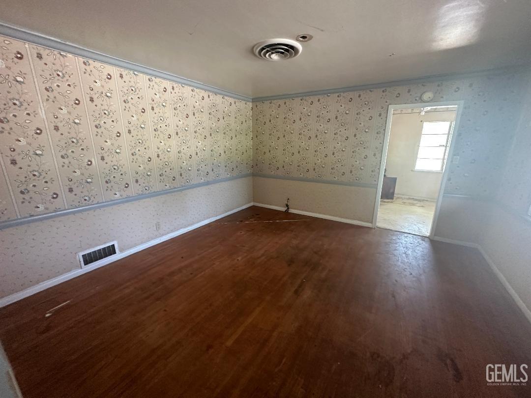Undisclosed Address Bakersfield, CA 93306 - Photo 9 of 16 a view of a room with wooden floor and white walls