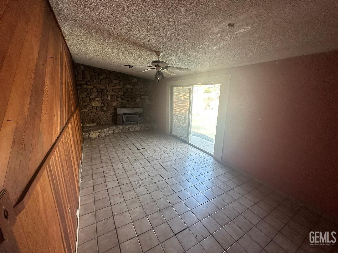 Undisclosed Address Bakersfield, CA 93306 - Photo 10 of 16 a view of empty room with wooden floor and fan